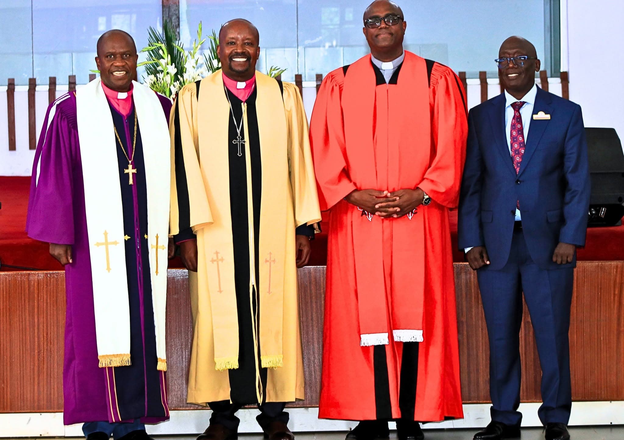 The four members of the AIC Diaspora Area Church leadership, standing together.